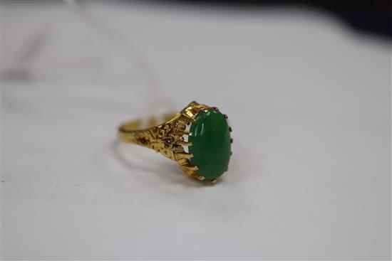 A Chinese yellow metal and jade ring, size L and a delicate gold mother of pearl and turquoise fringe necklace